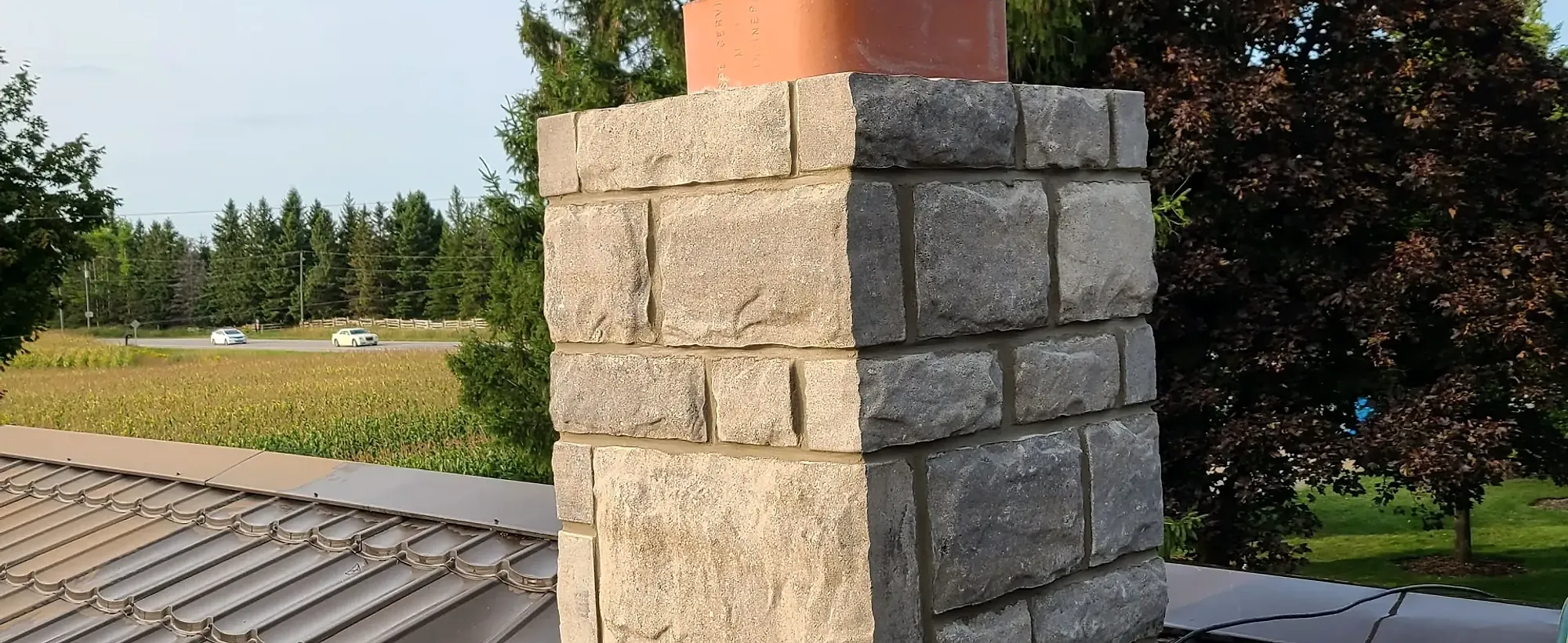 Stone chimney base with a new clay flue liner
