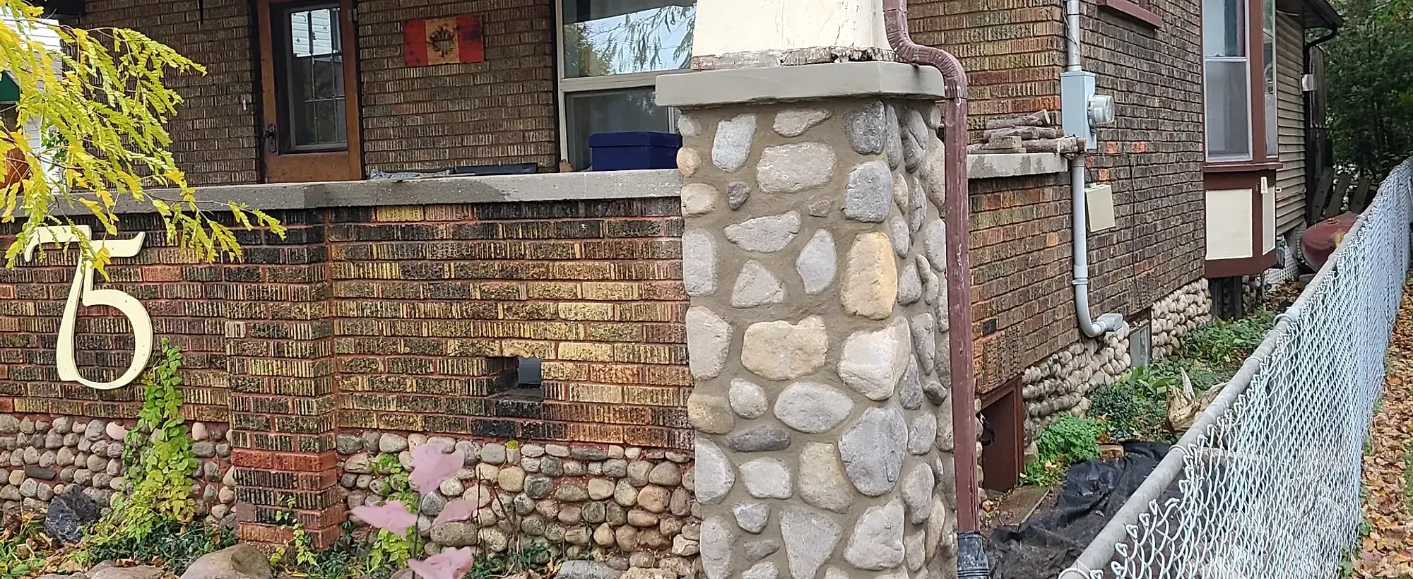 Brick home corner with new soffit and roofline detailing