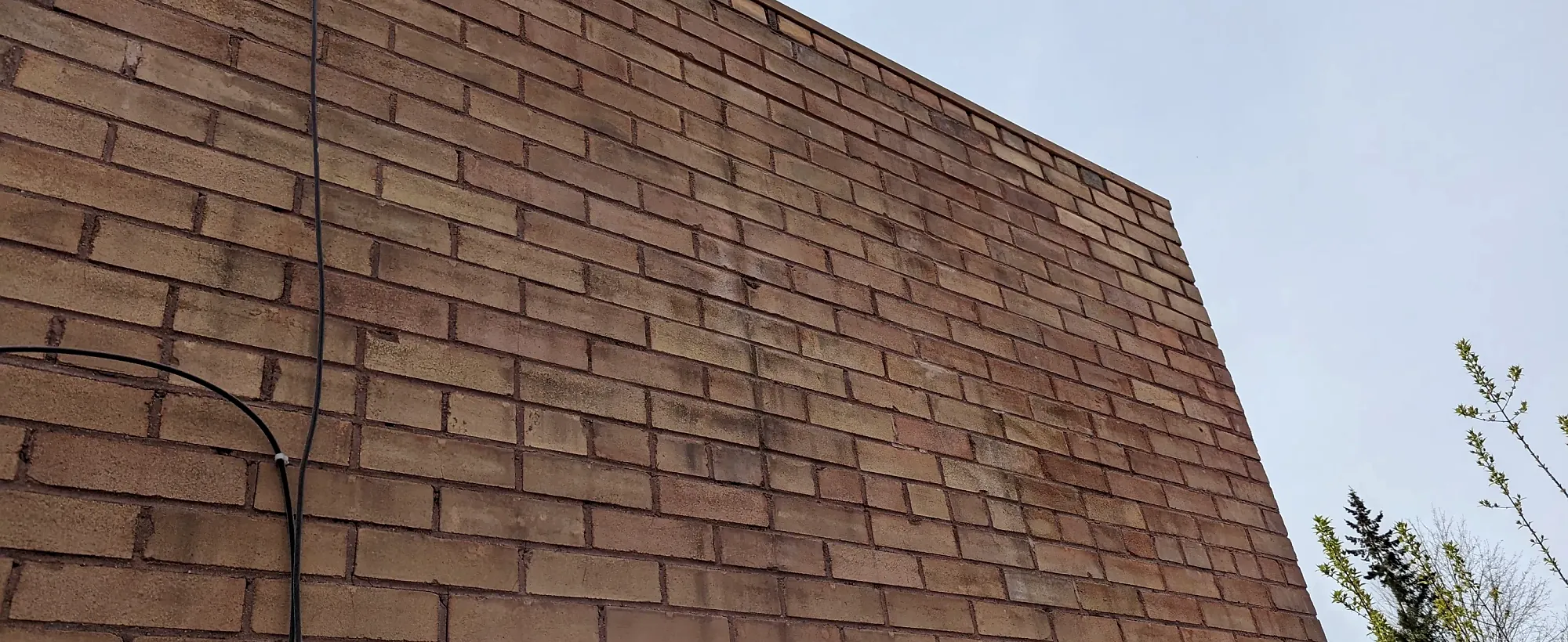 Brown brick gable wall built by Parker Masonry