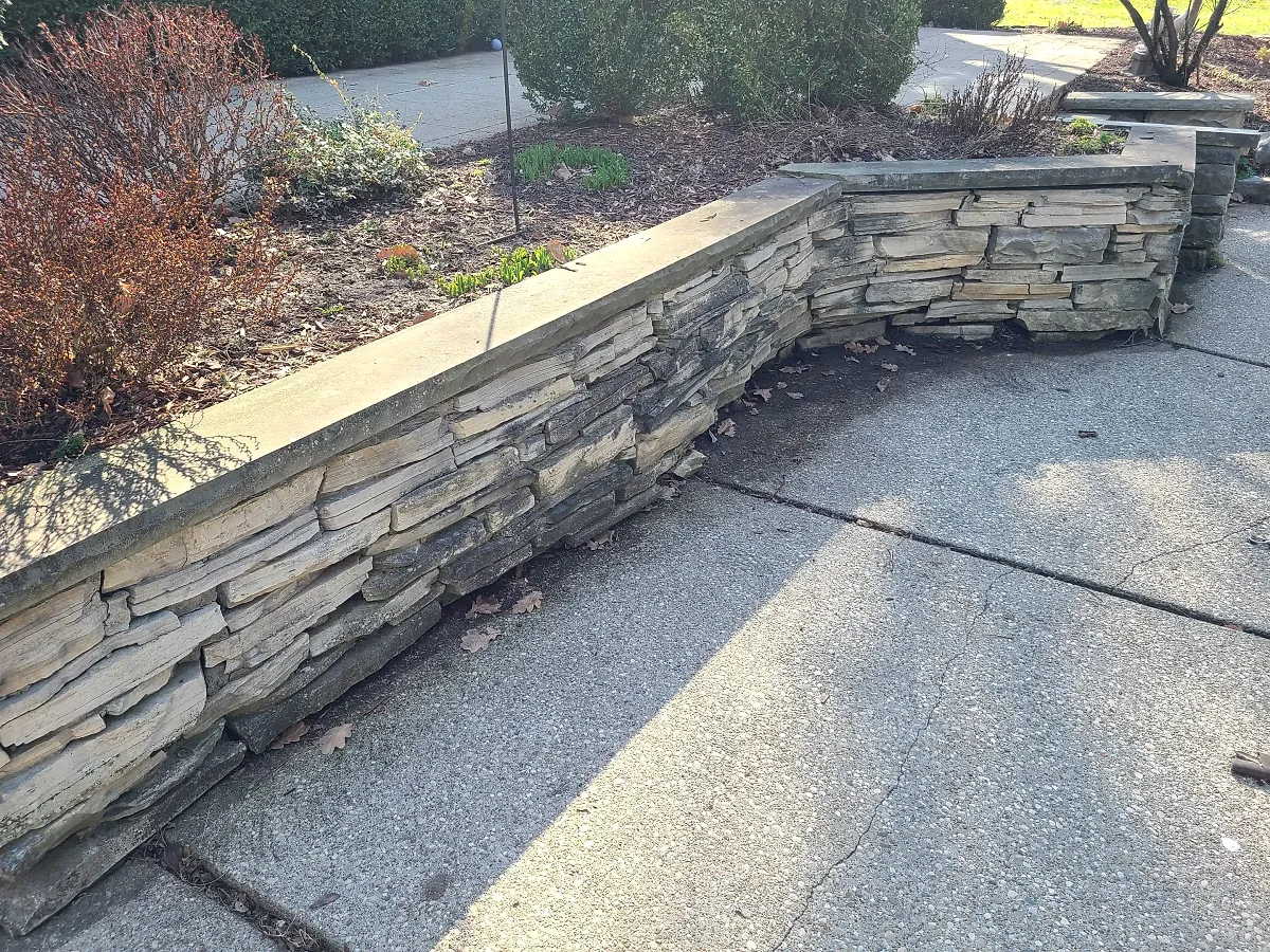 Low natural stone garden retaining wall