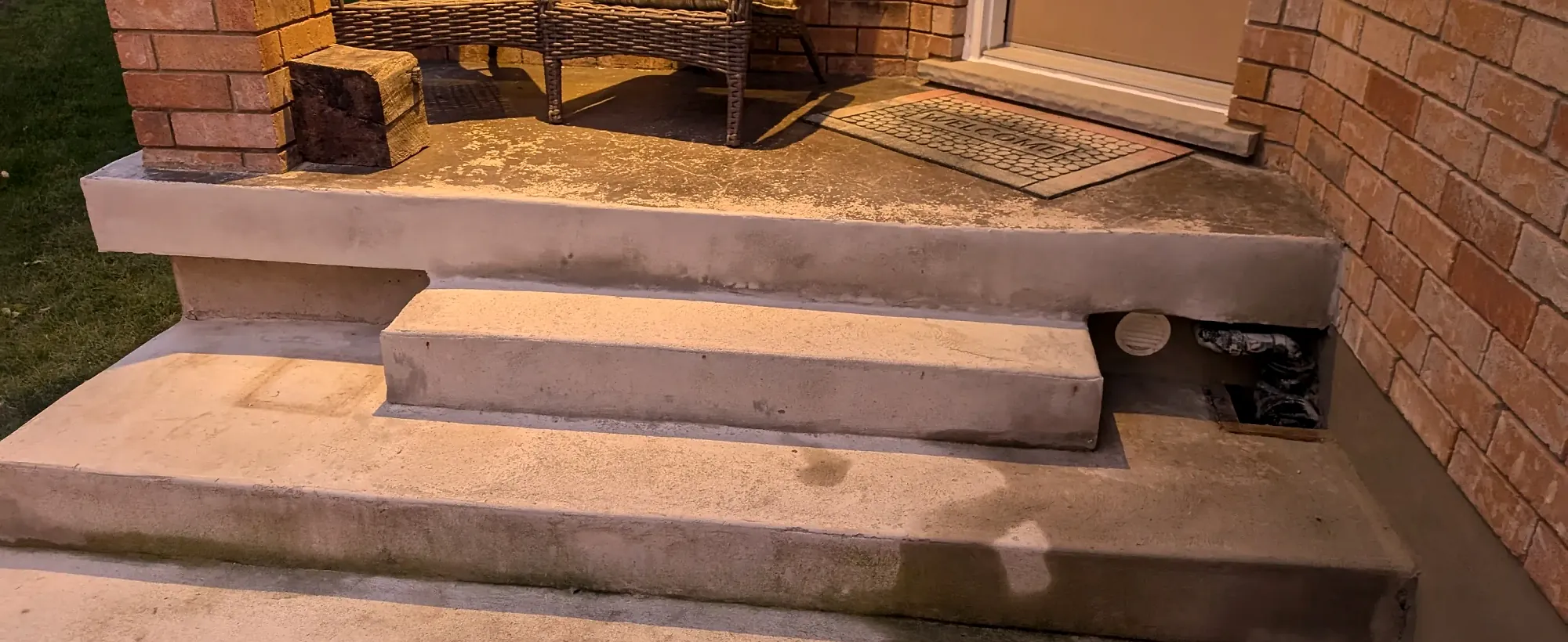 Precast concrete front steps at a doorway